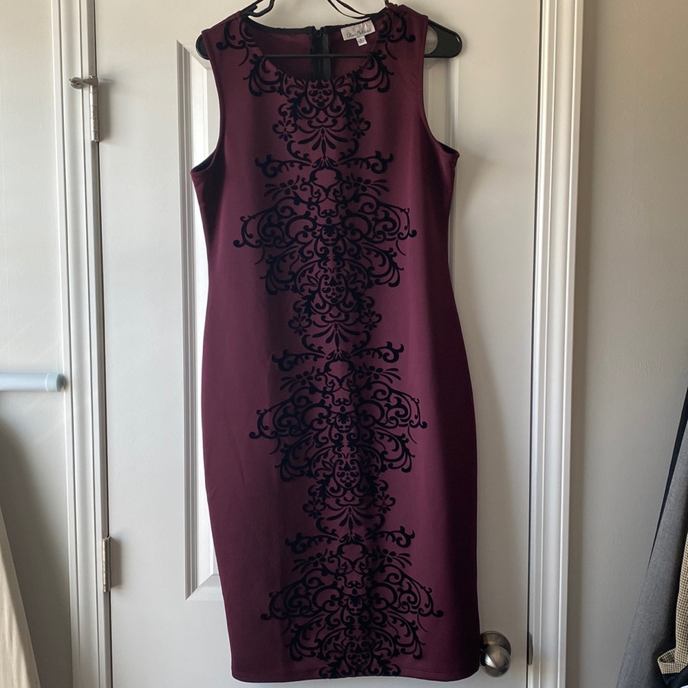 Pretty maroon/purple colored sheath style dress with detailing